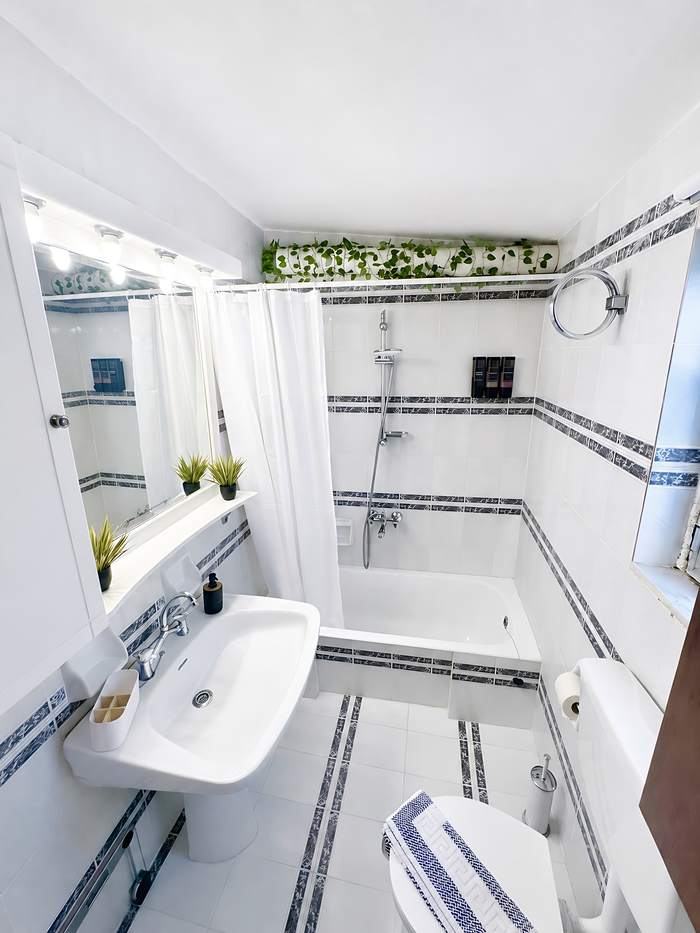 Bright bathroom with bathtub and shower