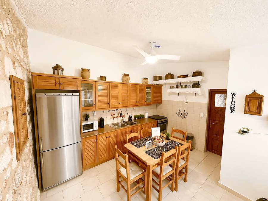 Fully equipped kitchen with dining table for six